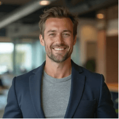 Professional headshot of a man in dark blue blazer