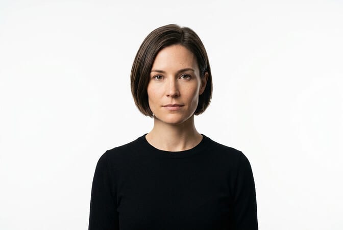 Minimal modern headshot style with single color background clean lines and focus on the subject with no visual distractions